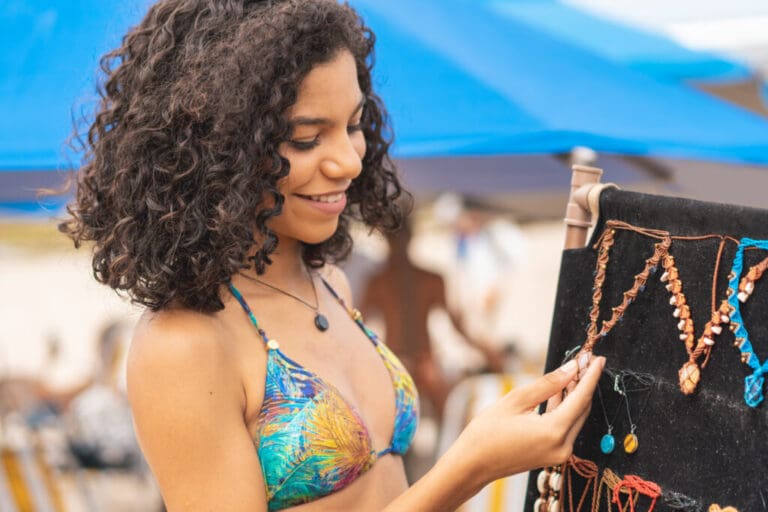 Tourist buying costume jewelry at the beach